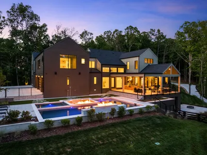 an aerial view of a house with garden space and street view