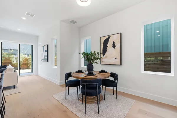 a dining room with furniture and window