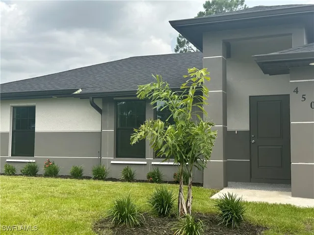 a view of front door and yard