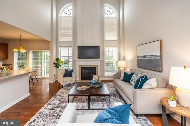 a spacious bedroom with a bed and a chandelier