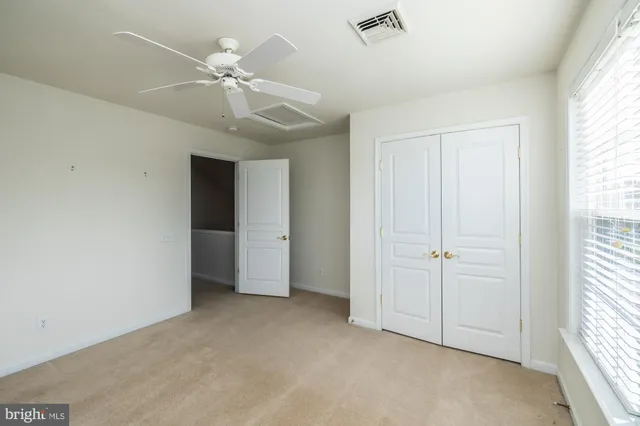 a view of a patio with a dining table and chairs with wooden floor