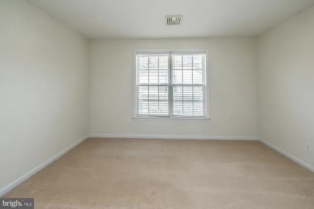 a view of a patio with table and chairs with wooden floor and fence