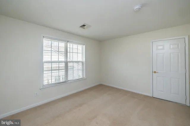 a view of a house with a yard and plants