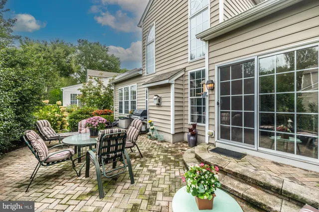 a view of a swimming pool with a table and chairs