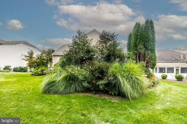 an aerial view of a house with a swimming pool