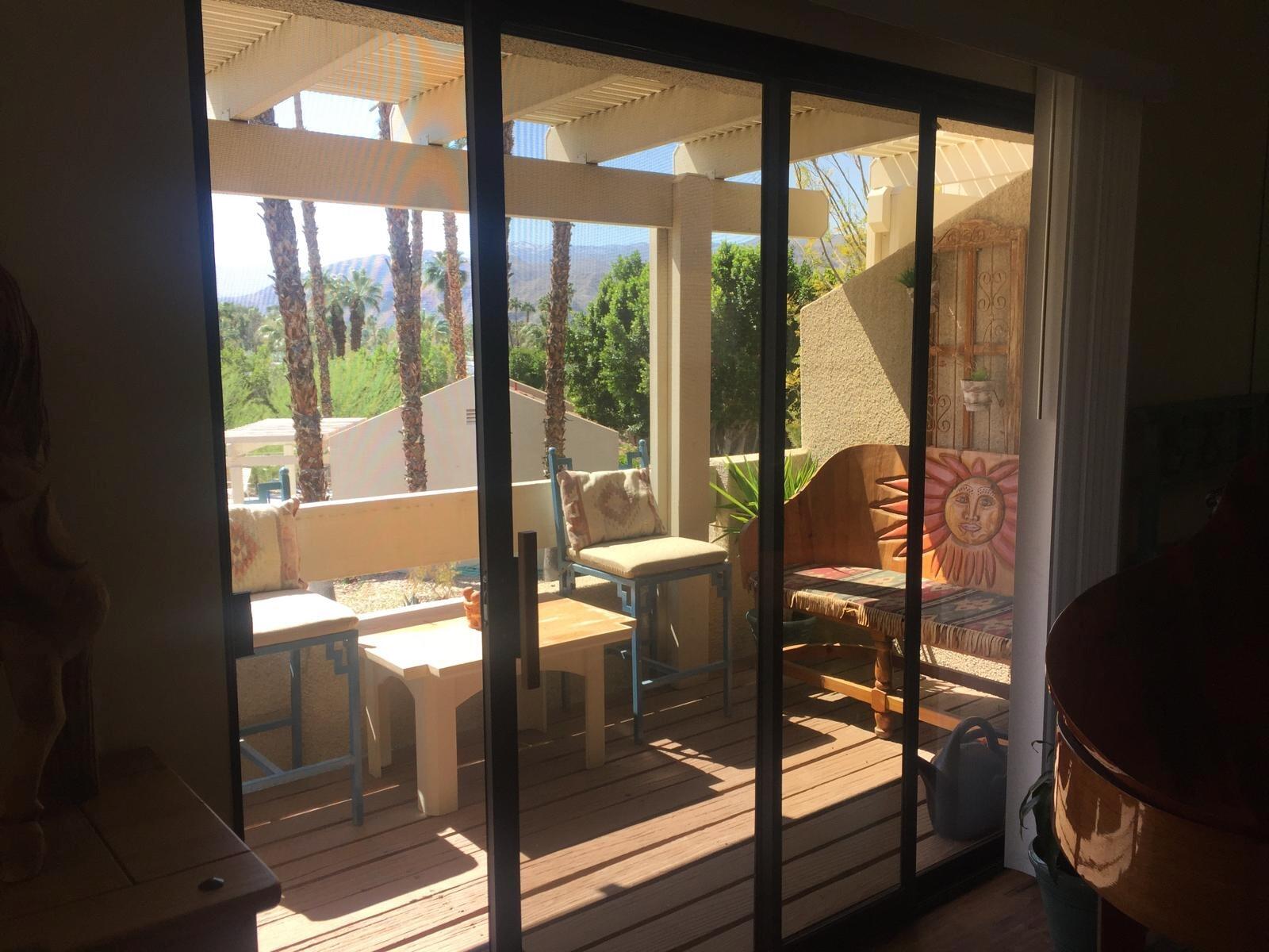 8 Mission Court Rancho Mirage, CA 92270 - Photo 11 of 17 a view of living room with a floor to ceiling window and wooden floor
