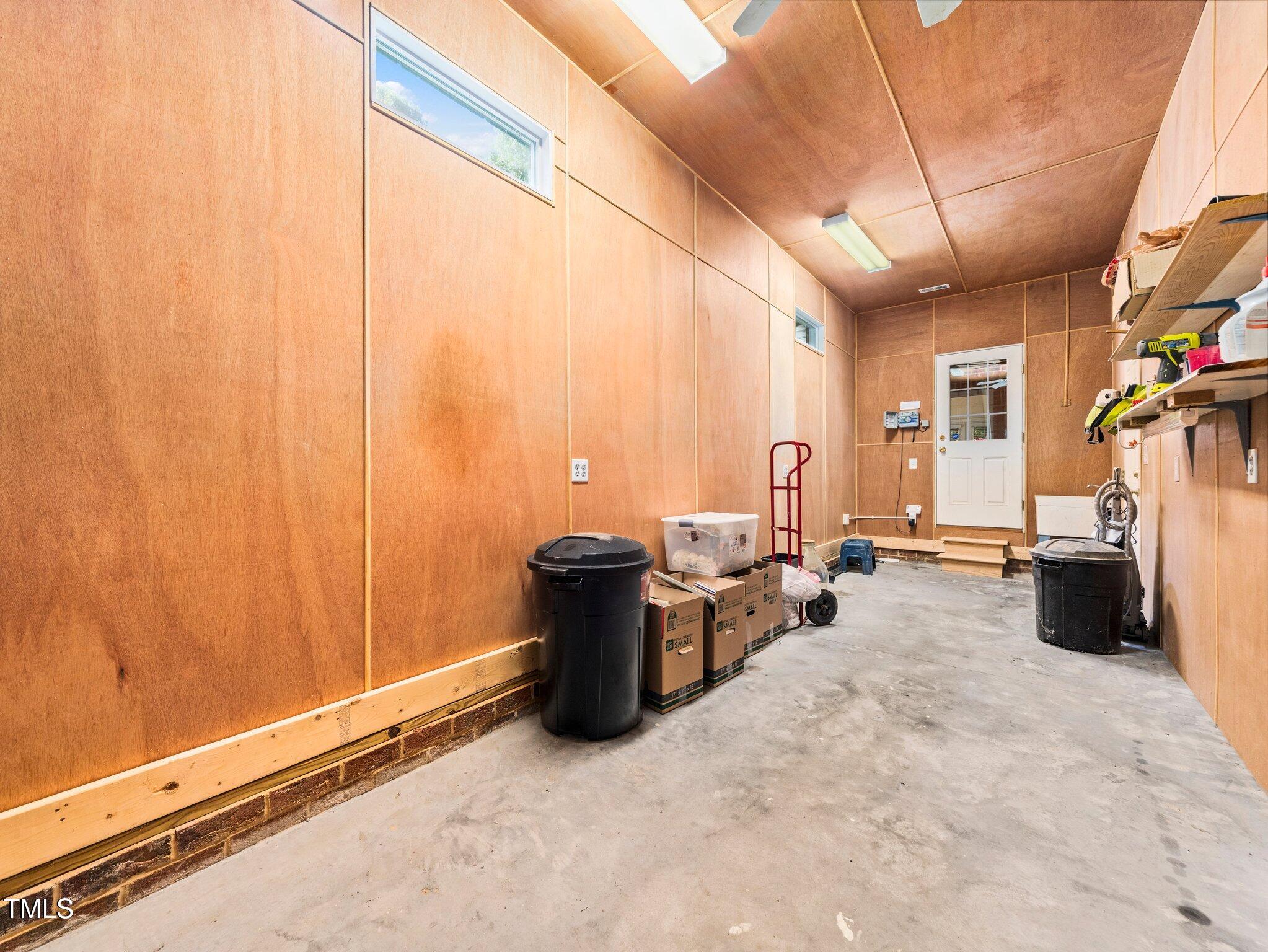 10937 Cahill Road Raleigh, NC 27614 - Photo 43 of 53 24 X 8 Wrkshp is Climate Controlled, has a Utility Sink + Access Door to Outside