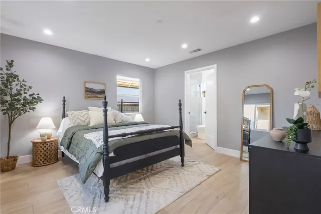 a bedroom with bed and window