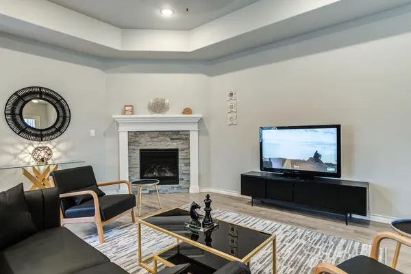 a living room with furniture and a fireplace