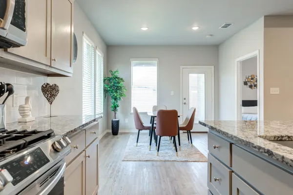 a view of dining table chairs and entryway