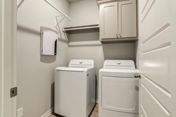 a utility room with dryer and washer