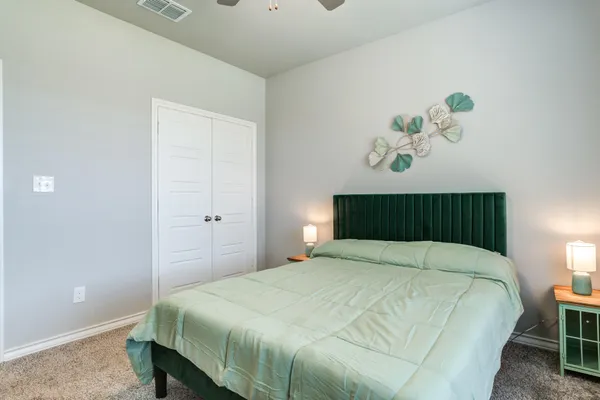 a bedroom with a bed and a table