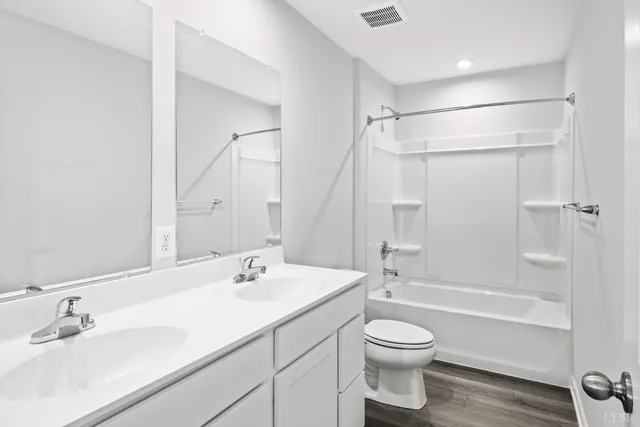 a bathroom with a sink a toilet and a bathtub