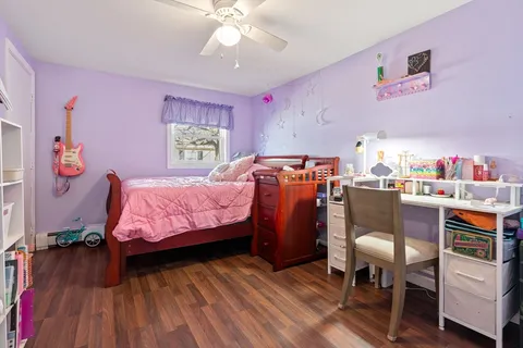 a bed room with a bed and a chandelier