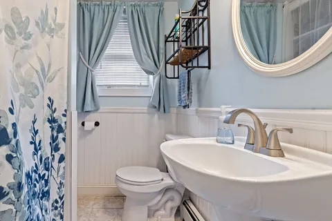 a bathroom with a toilet and a sink