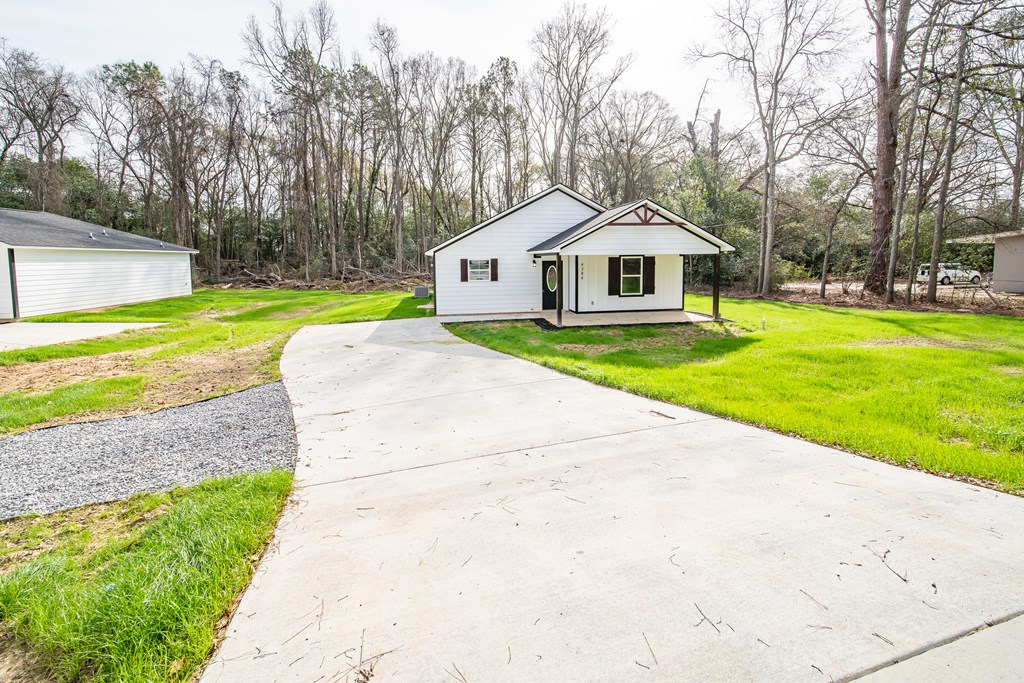4384 Forrest Road Columbus, GA 31907 - Photo 2 of 30 a front view of a house with garden