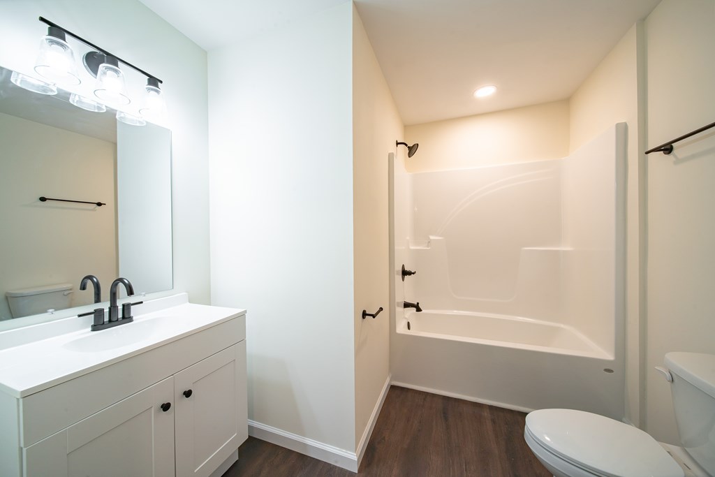 4384 Forrest Road Columbus, GA 31907 - Photo 24 of 30 a bathroom with a sink a toilet and shower