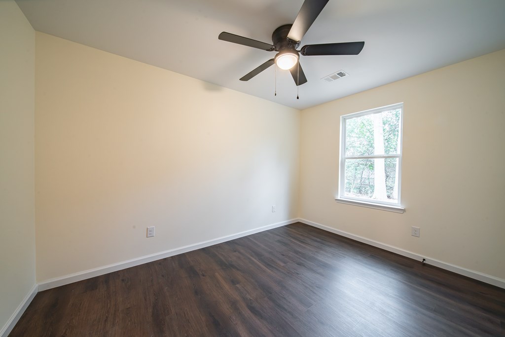 4384 Forrest Road Columbus, GA 31907 - Photo 26 of 30 an empty room with wooden floor and windows