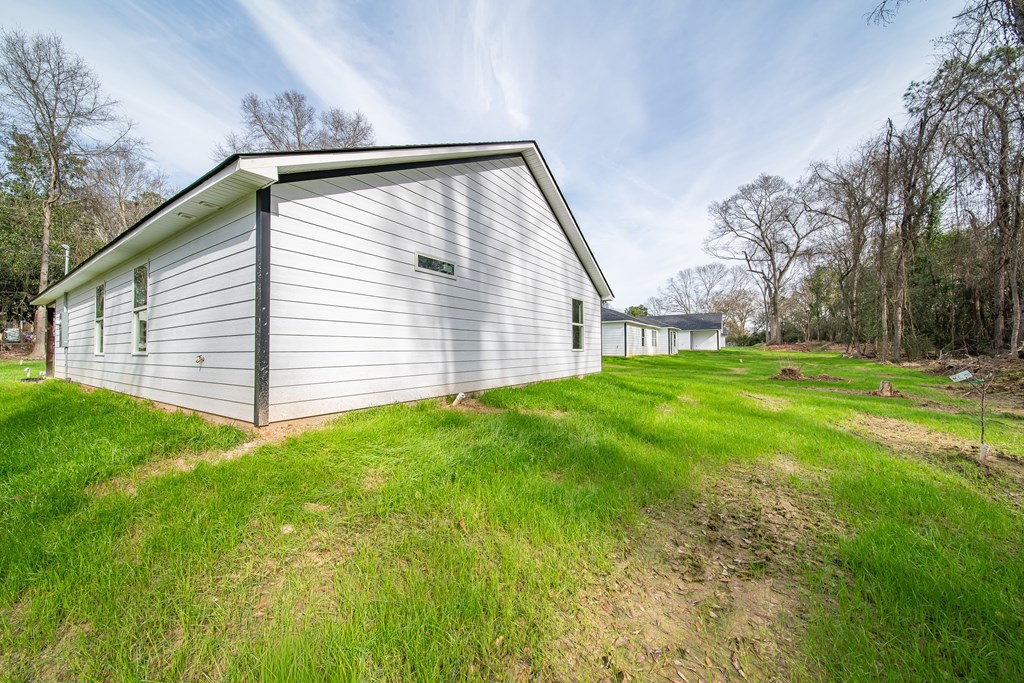 4384 Forrest Road Columbus, GA 31907 - Photo 29 of 30 a view of a backyard with plants and large trees