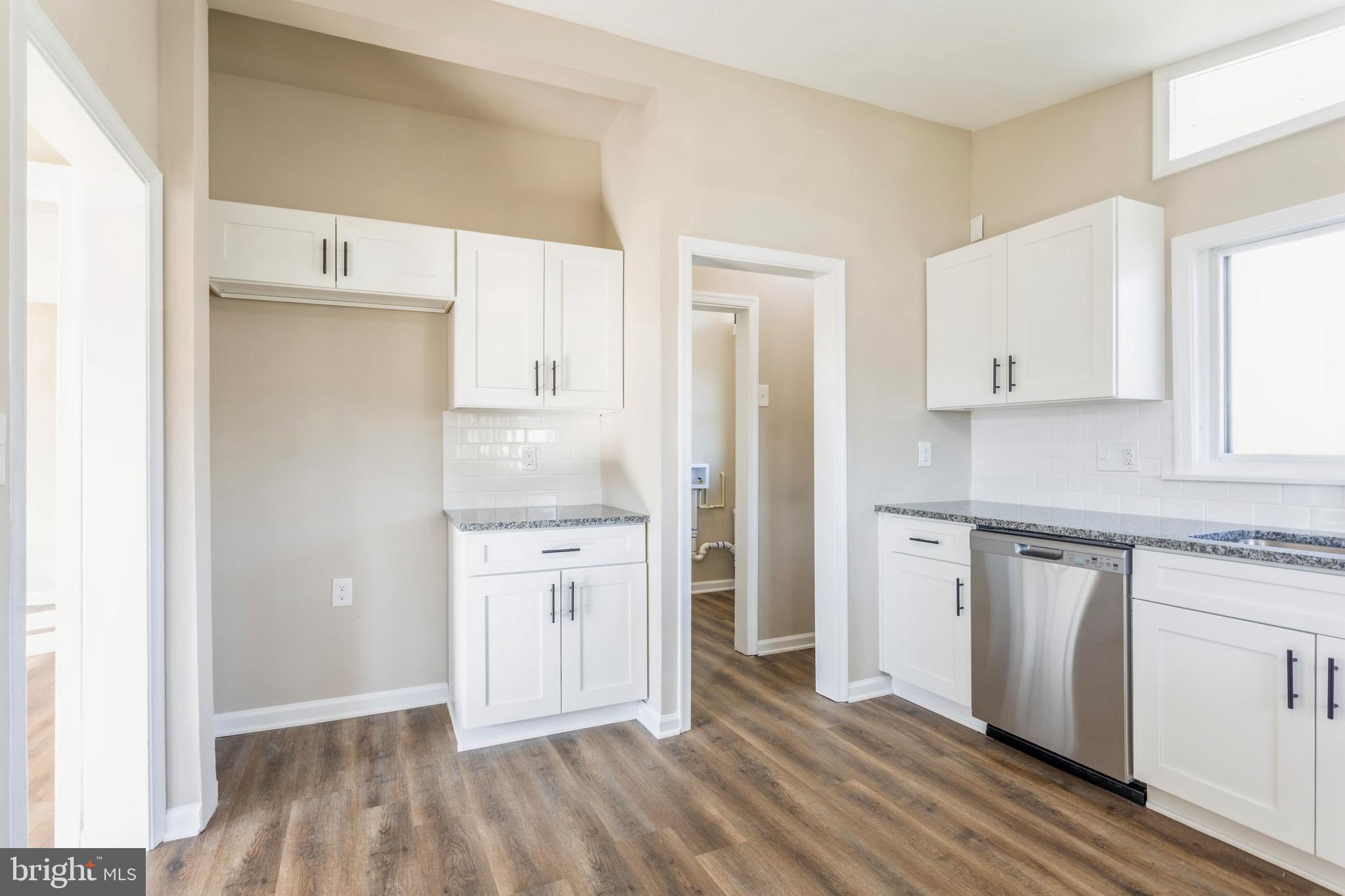 1666 Bay Ridge Road Edgewater, MD 21037 - Photo 11 of 34 a kitchen with granite countertop white cabinets and stainless steel appliances