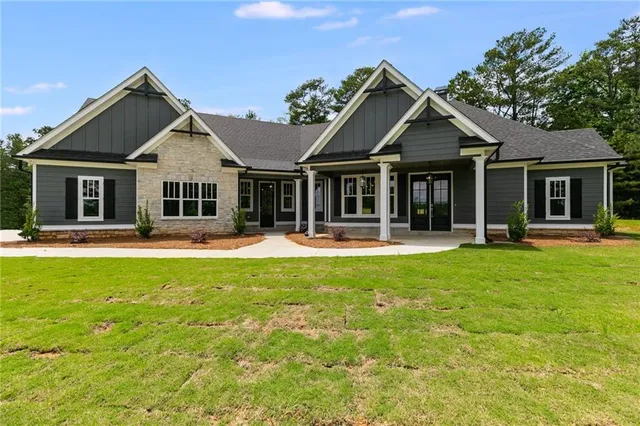 a front view of a house with a yard