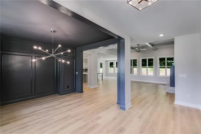 a view of an empty room with a fireplace