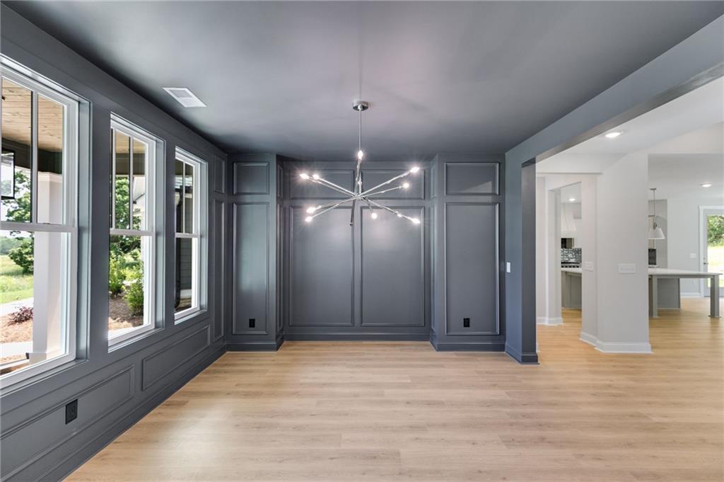 662 Lake Cir Road Buchanan, GA 30113 - Photo 13 of 62 a view of a livingroom with a chandelier fan and windows