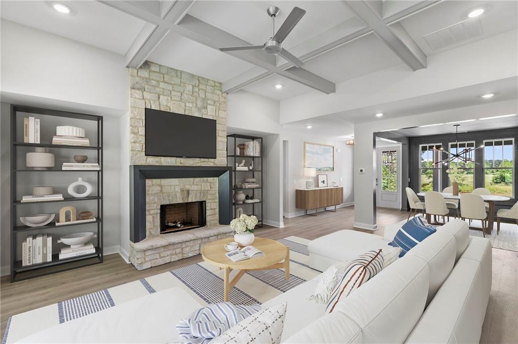 662 Lake Cir Road Buchanan, GA 30113 - Photo 15 of 62 a living room with furniture a flat screen tv and a fireplace