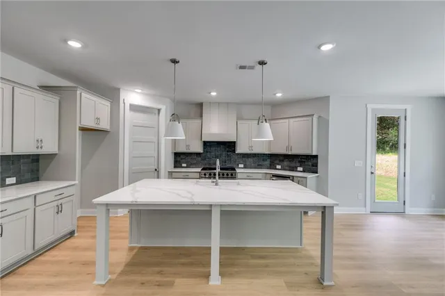 a dining room with furniture window and wooden floor