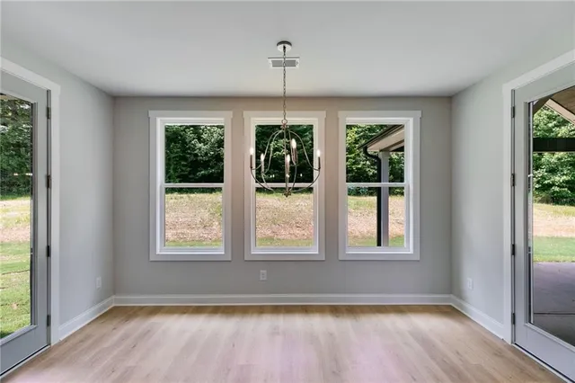 a view of a kitchen with a sink and a chandelier