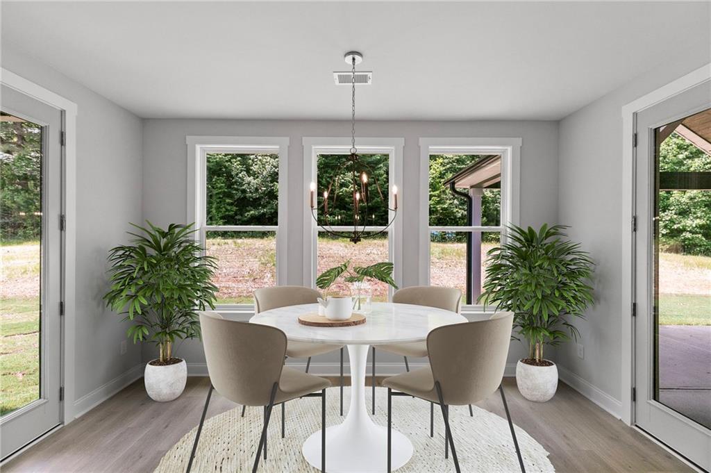 662 Lake Cir Road Buchanan, GA 30113 - Photo 21 of 62 a dining room with furniture window and wooden floor