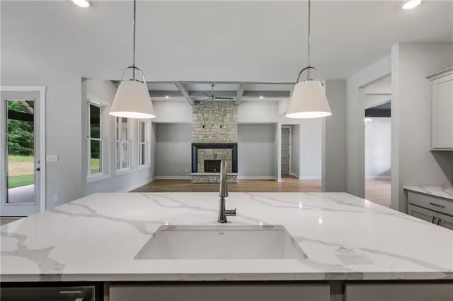a view of a hallway with wooden floor and entryway