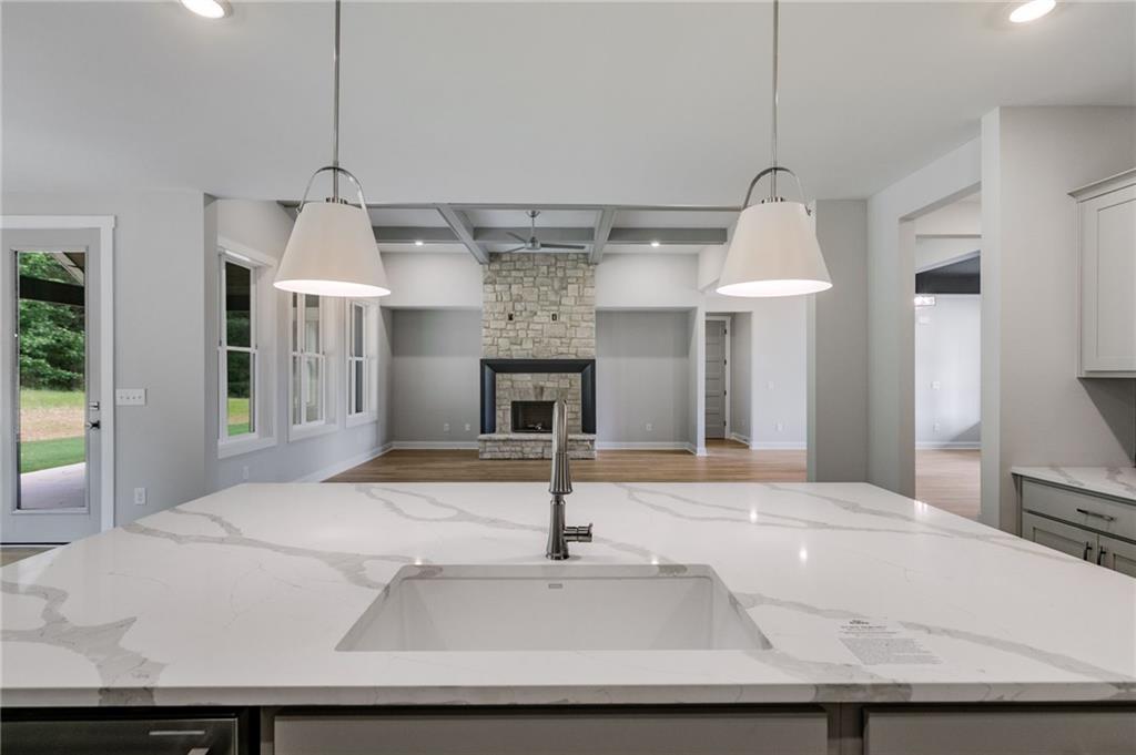 662 Lake Cir Road Buchanan, GA 30113 - Photo 24 of 62 a view of a kitchen with a sink and a chandelier