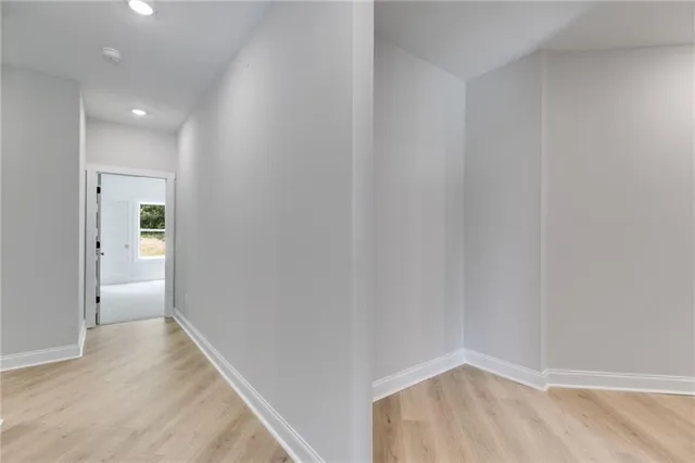 a bathroom with a sink a toilet and a large mirror