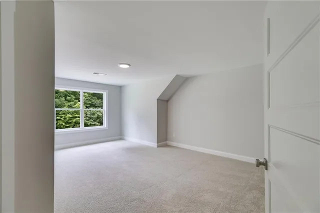 a white bath tub sitting next to a shower