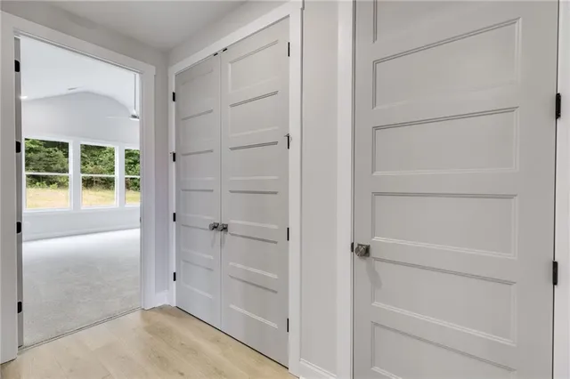 a bathroom with double sink and a mirror