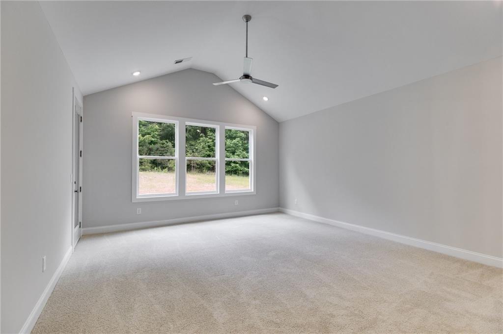 662 Lake Cir Road Buchanan, GA 30113 - Photo 45 of 62 a view of a room with windows and ceiling fan