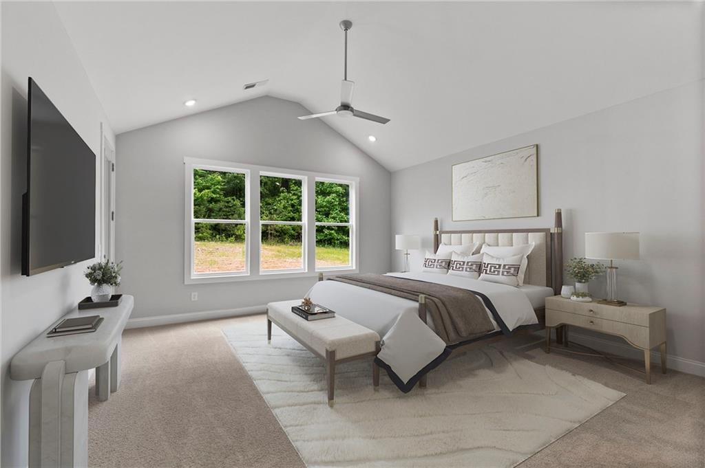 662 Lake Cir Road Buchanan, GA 30113 - Photo 46 of 62 a spacious bedroom with a bed and a flat screen tv