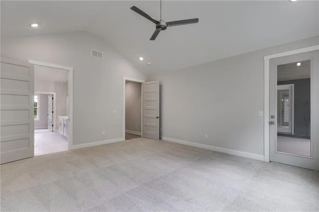 a front view of a house with yard and green space