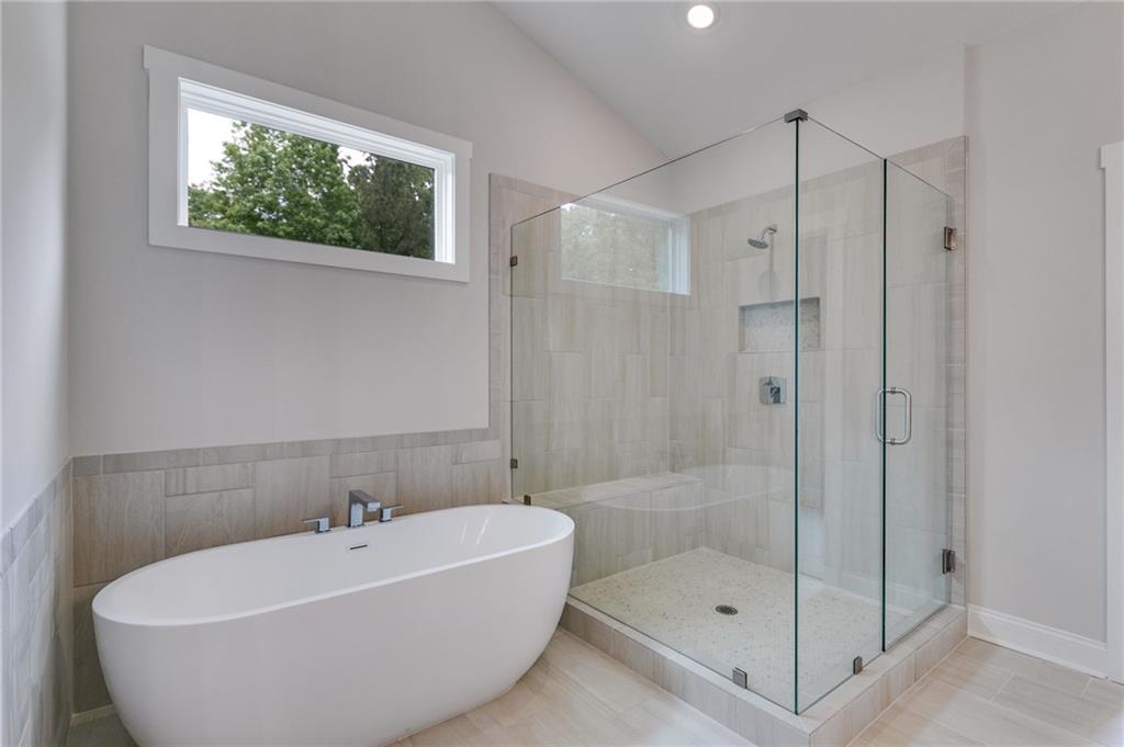 662 Lake Cir Road Buchanan, GA 30113 - Photo 50 of 62 a white bath tub sitting next to a shower