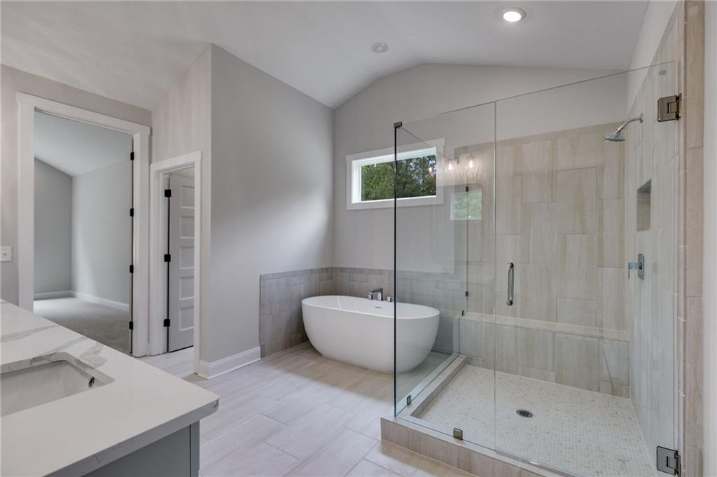 662 Lake Cir Road Buchanan, GA 30113 - Photo 54 of 62 a spacious bathroom with a bathtub and a shower