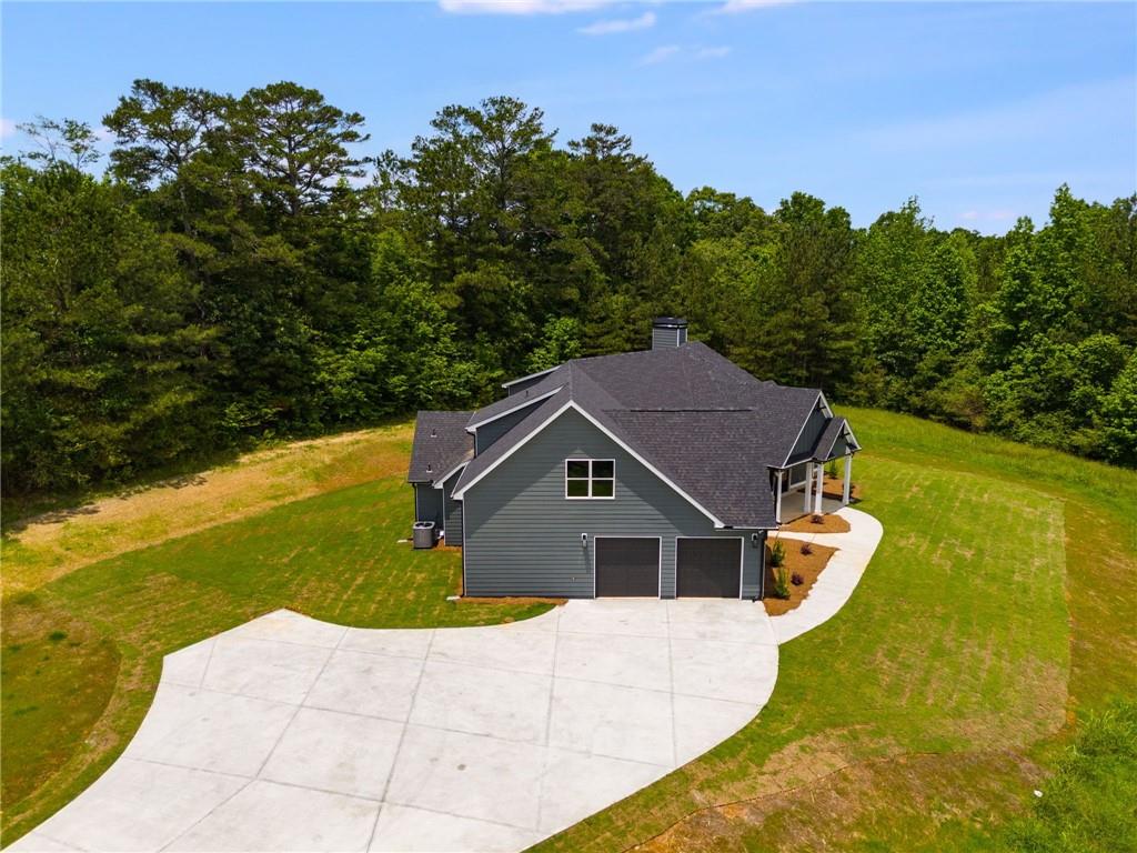 662 Lake Cir Road Buchanan, GA 30113 - Photo 61 of 62 a house with trees in the background