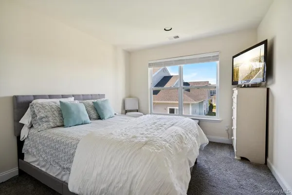 a bed room with a bed and a window