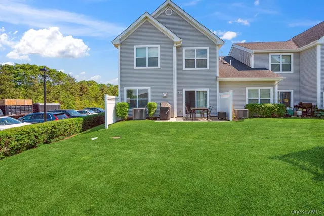 a front view of the house with a yard