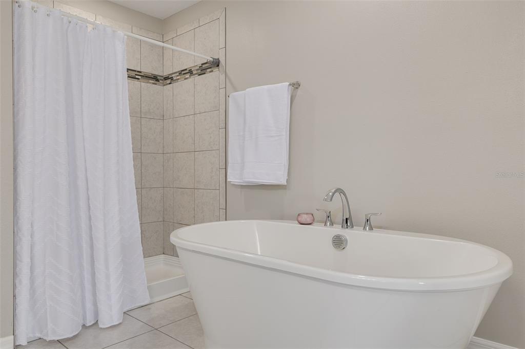 7242 Landmark Drive Spring Hill, FL 34606 - Photo 32 of 45 a white bath tub sitting next to a white sink