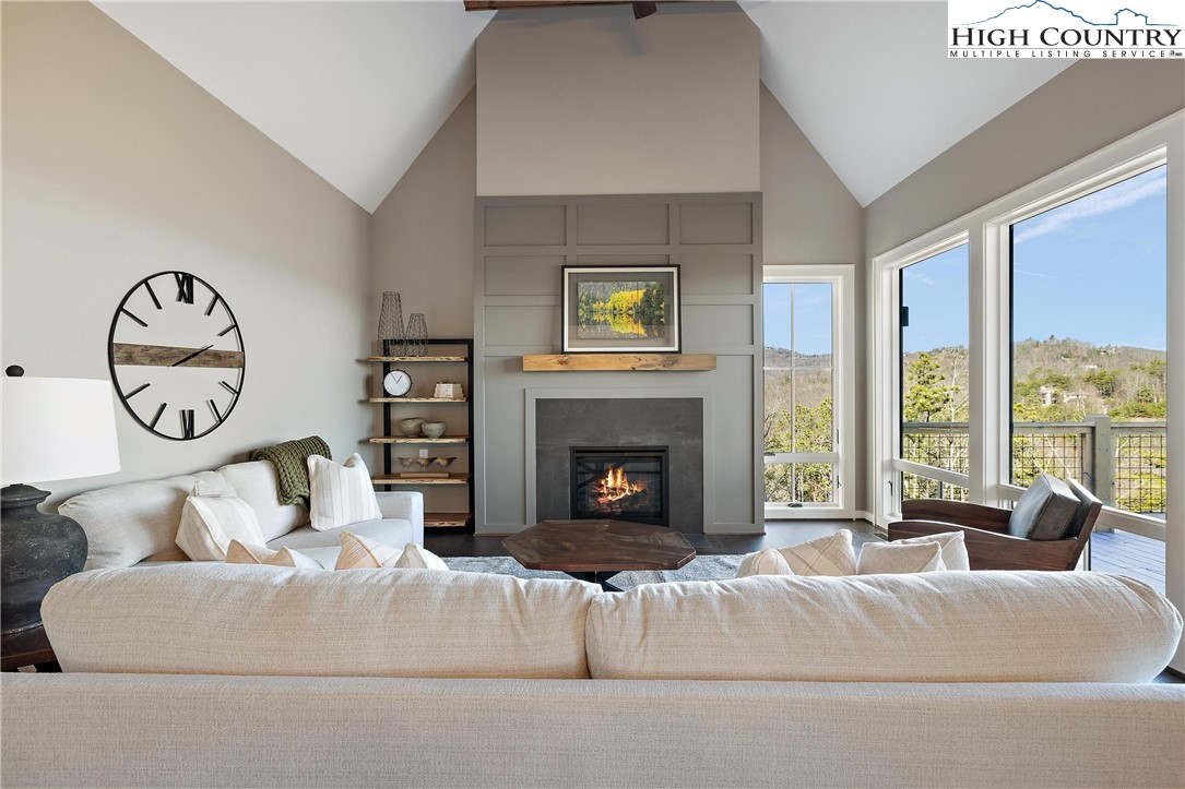 150 Calico Court Boone, NC 28607 - Photo 11 of 50 a living room with furniture and a fireplace