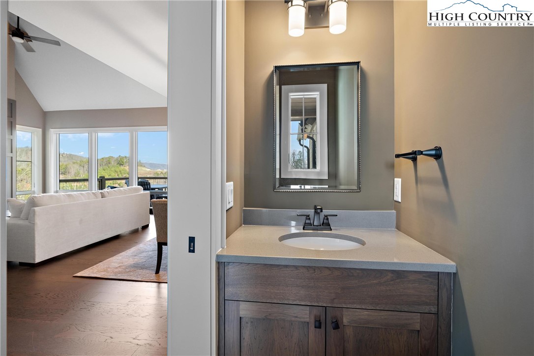 150 Calico Court Boone, NC 28607 - Photo 13 of 50 a en suite bathroom with a sink and a mirror