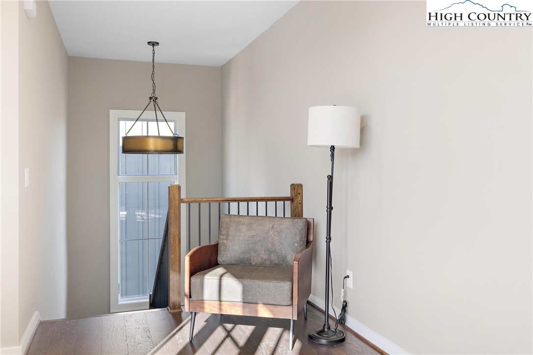 150 Calico Court Boone, NC 28607 - Photo 15 of 50 a bedroom with a bed and a lamp on the table