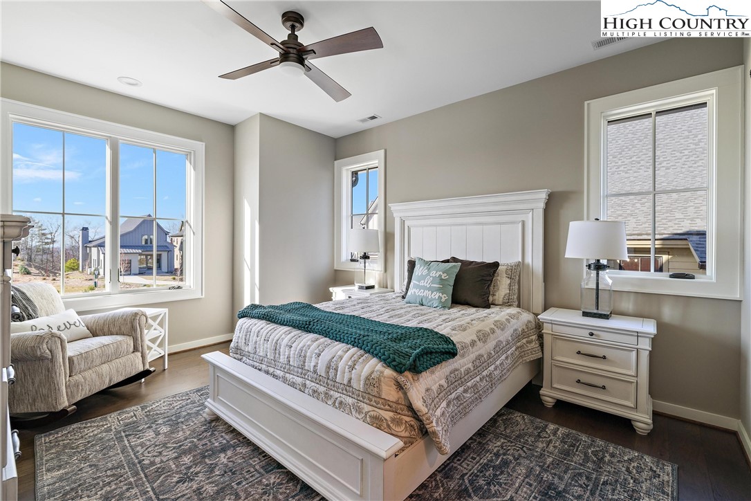 150 Calico Court Boone, NC 28607 - Photo 16 of 50 a bedroom with a bed and a couch