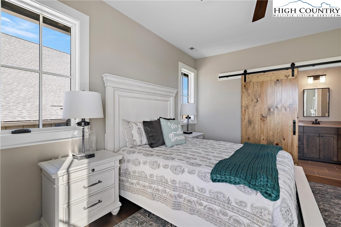 150 Calico Court Boone, NC 28607 - Photo 18 of 50 a bedroom with a bed and a large window